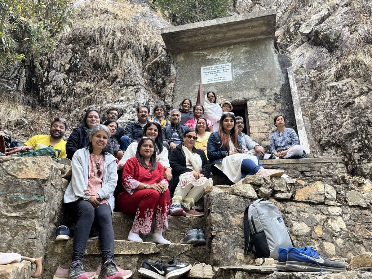 Seekers on the steps at Babaji Cave