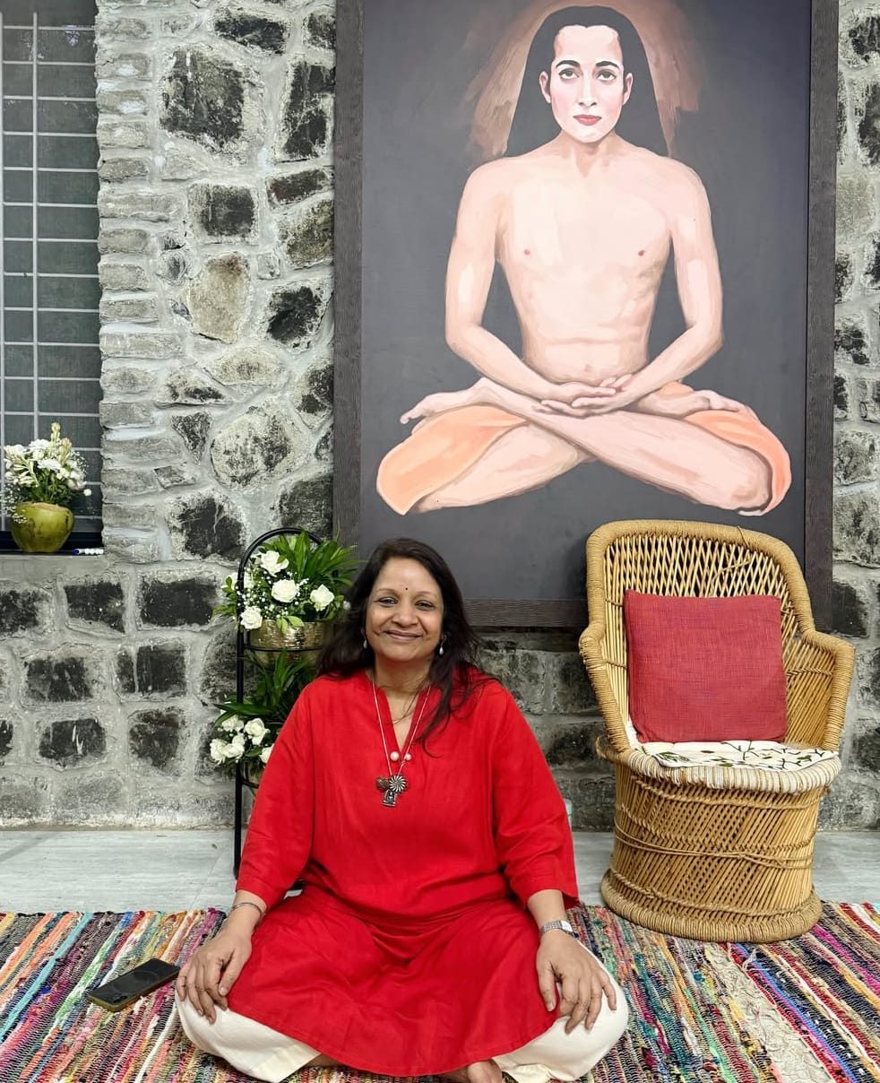 Muni seated before the Babaji portrait