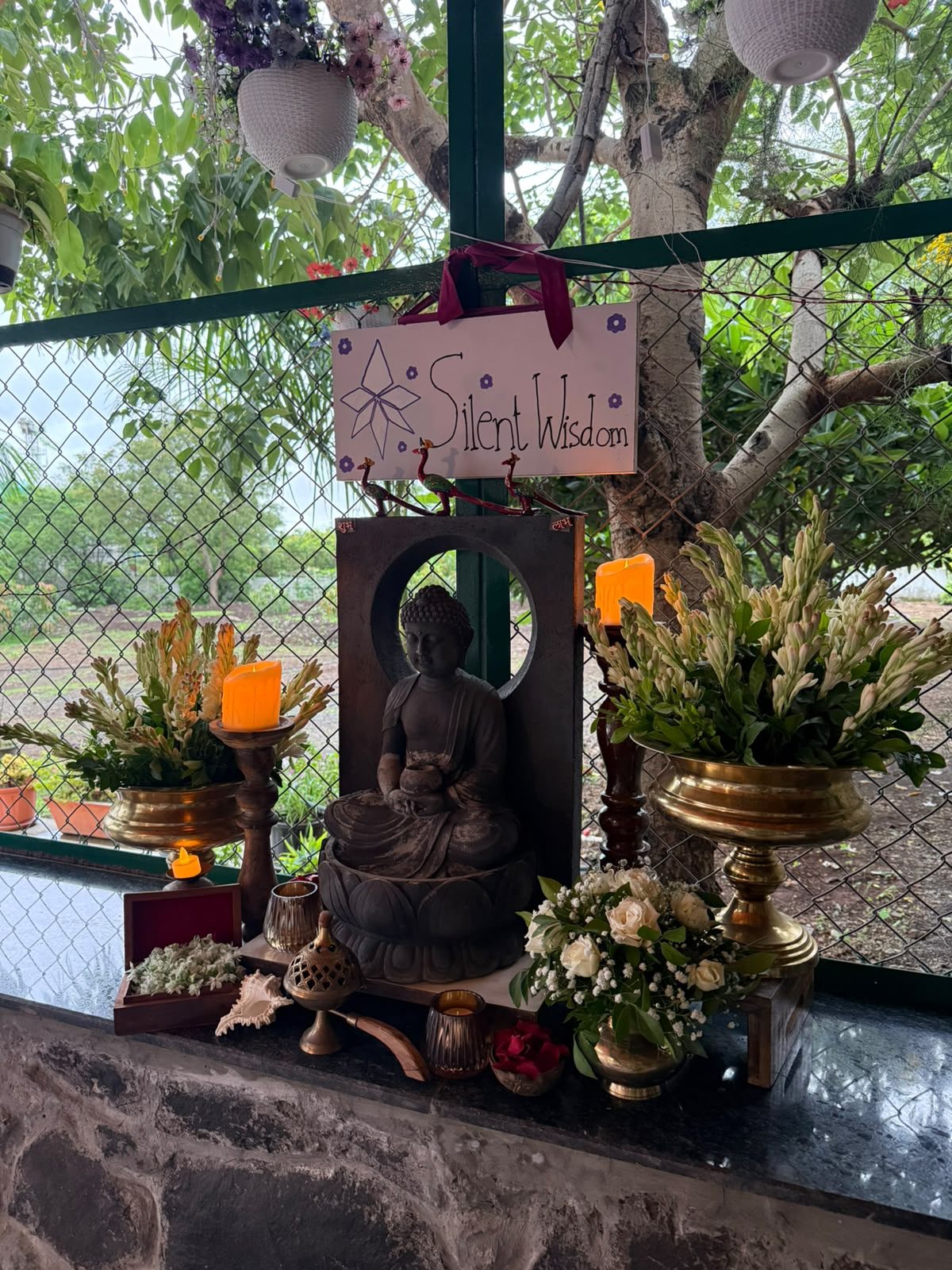 Silent Wisdom altar with candlelight